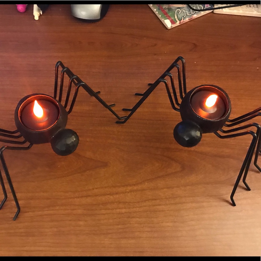 Two metal spider candle holders